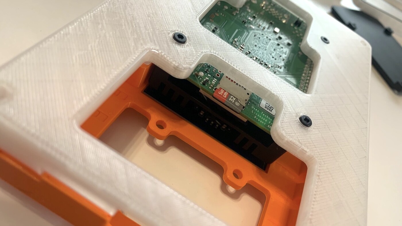 Insert screws that will secure Raspberry Pi